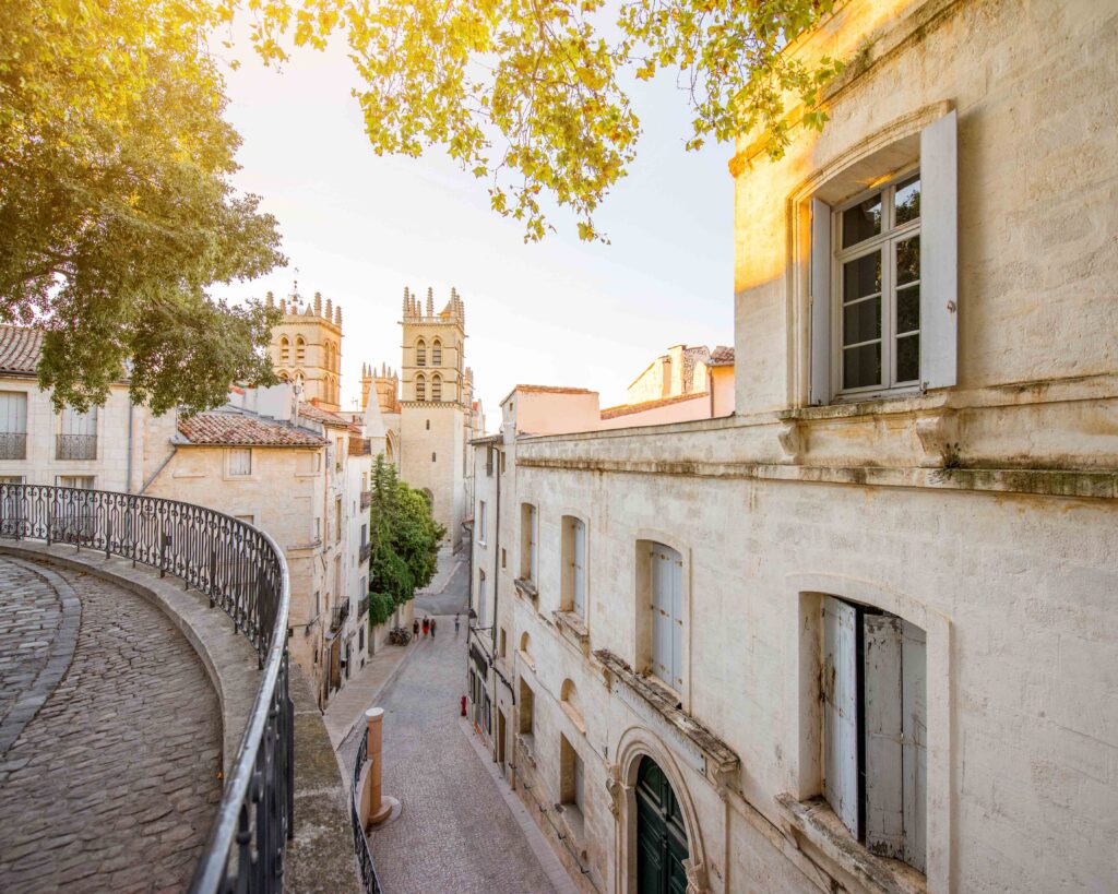 Street view with saint Pierre cathedral at the old town of Montpellier city in Occitanie region of France